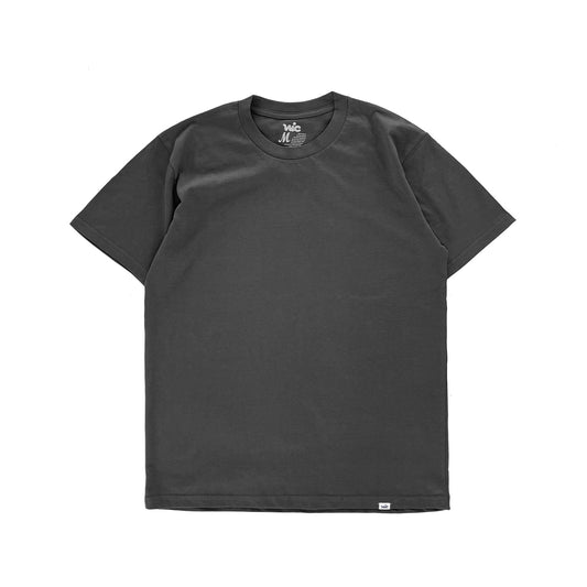 Introducing our essential Blank Tee, available in men's and women's sizes for a relaxed shorter body fit. Crafted from 220 GSM heavyweight combed cotton jersey, this tee guarantees durability and luxurious comfort. Soft-washed to minimize shrinkage, it maintains a consistent fit over time. With a plain design and a discreet woven label at the hem, this tee offers timeless simplicity for any occasion.