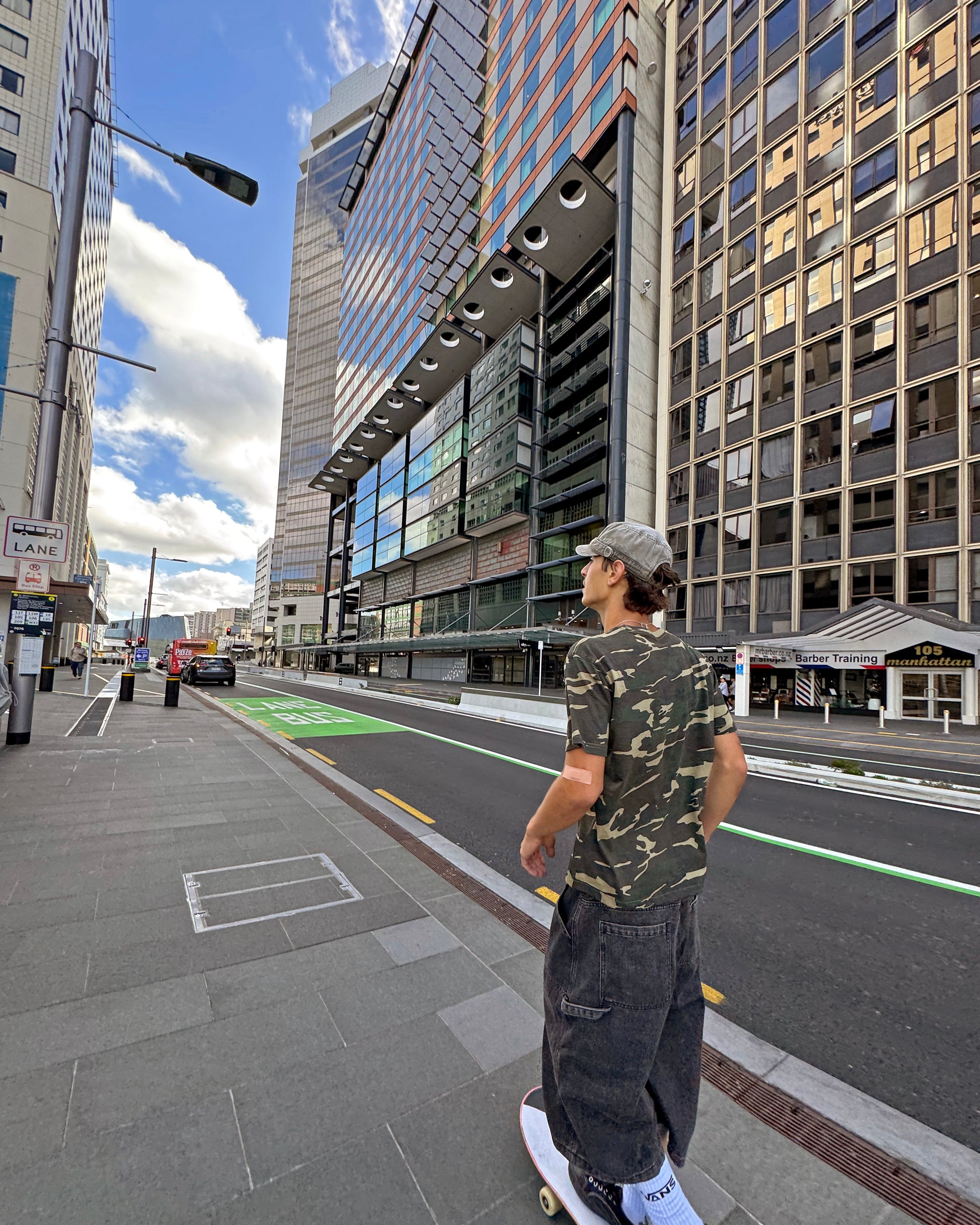 Unisex Camo Box Tee in Woodland and Black Camo, Box Fit with Shorter Body, 180 GSM Mid-Weight Cotton, Left Chest Logo Embroidery. Baggy Patch Pocket Jorts