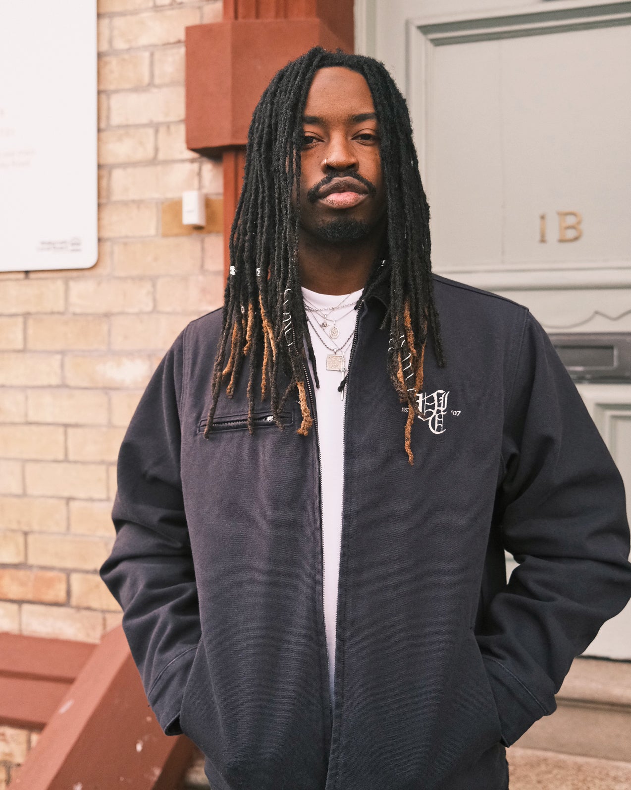 OL' ENGLISH CANVAS CORD COLLAR JACKET – A tough, heavyweight 470 GSM cotton duck canvas workwear jacket with a 16 wale corduroy collar, blanket lining, and adjustable fit. Inspired by vintage workwear. Built for durability with multiple pockets, YKK zip, and embroidered logo, it’s made to handle long days—whether on the job or out skating in the cold.