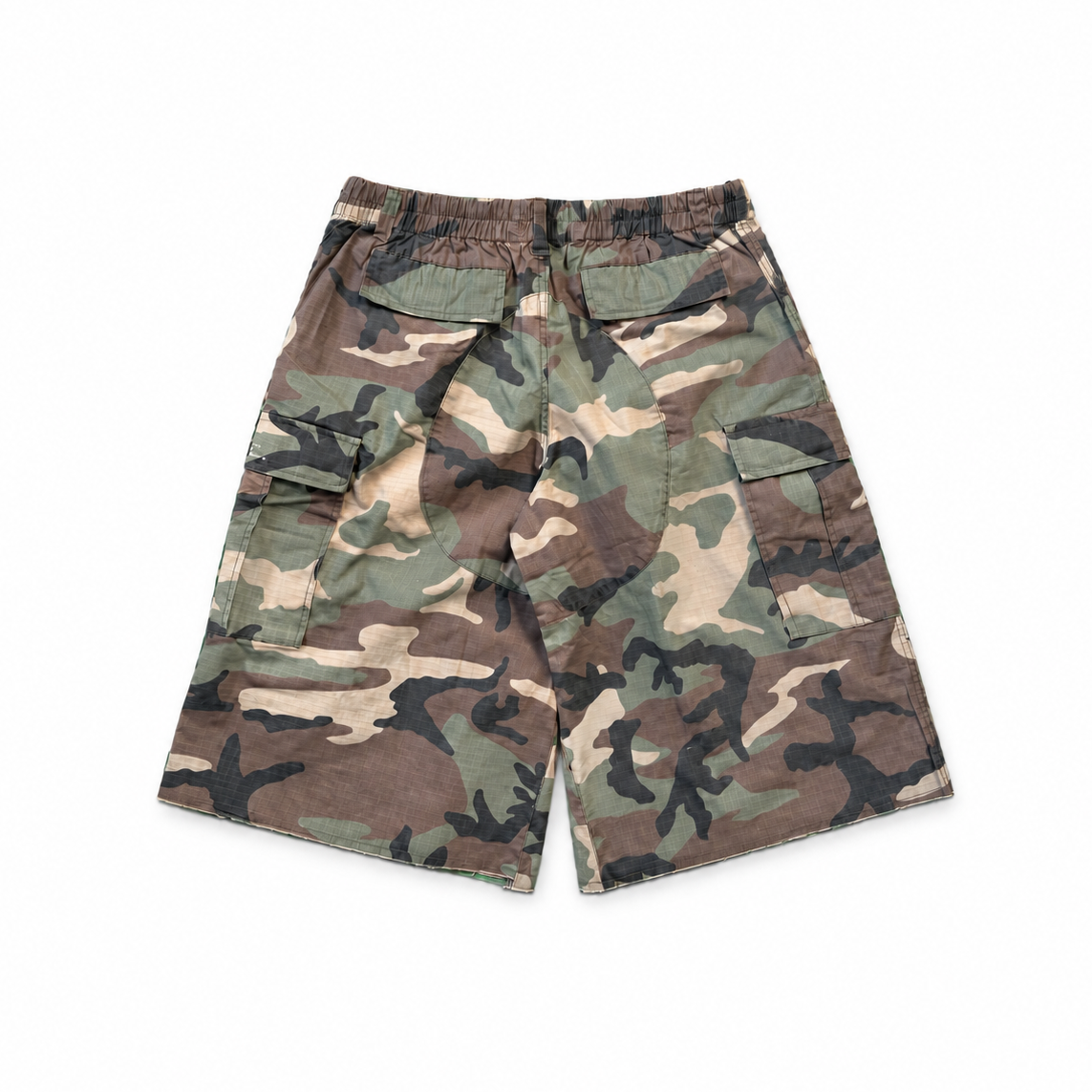 Woodland camo cargo shorts with a relaxed, below-knee fit and raw hems