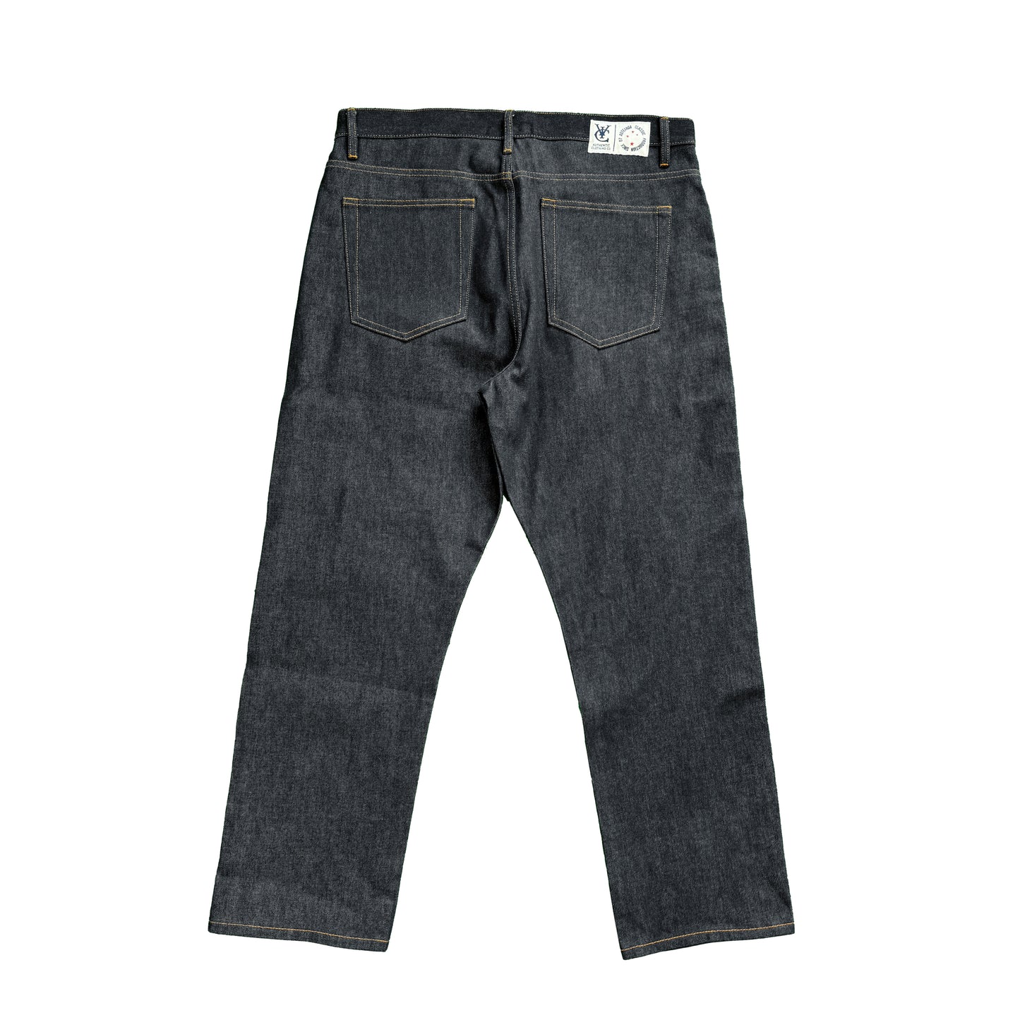 RAW SELVEDGE JEANS in dark indigo with a regular straight leg fit, cut from premium 15oz raw selvedge denim. Finished with contrast stitching, selvedge detail on the coin pocket, and a VIC woven patch on the waistband. Inspired by vintage Japanese selvedge denim and reimagined with a modern silhouette.