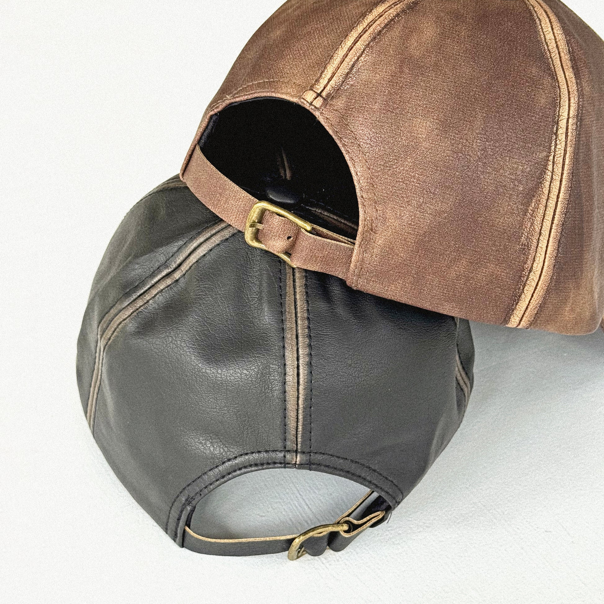 Ol English Leather Baseball Cap in black and brown, faux leather 6-panel hat with embroidered logo, adjustable strapback, one size fits all, vintage finish.