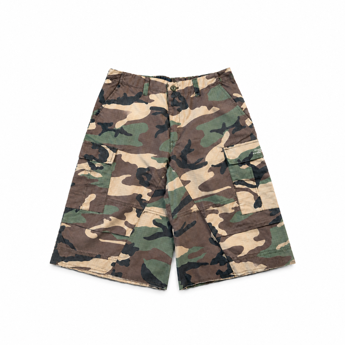 Woodland camo cargo shorts with a relaxed, below-knee fit and raw hems