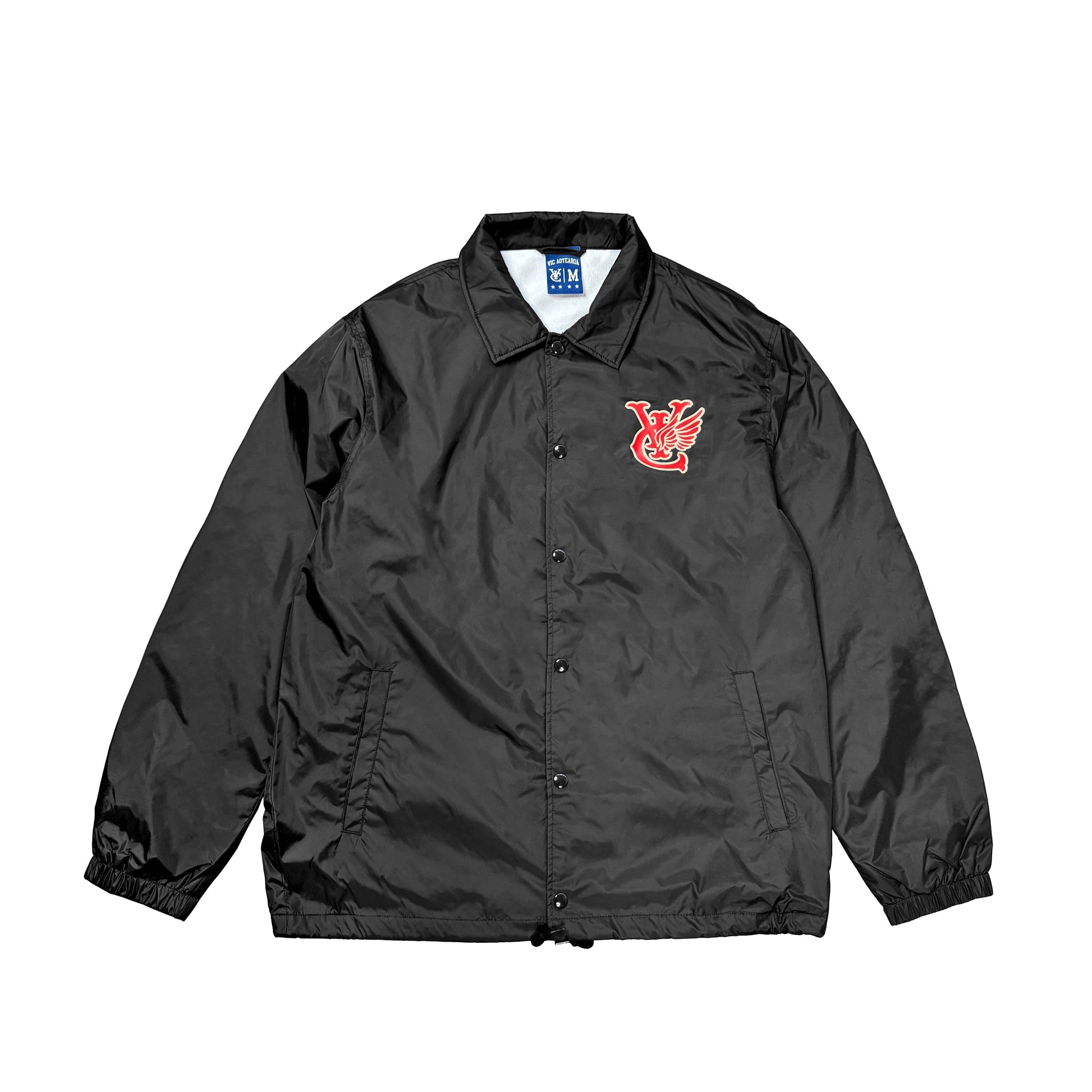 Introducing our Wing Coach Jacket: A durable micro poplin polyester jacket with a water-resistant finish. Stay comfortable with its lightweight microfiber lining and keep essentials handy with 2 side pockets. Featuring a printed logo at the left chest and a convenient YKK snap front closure. Elevate your style with ease in our Wing Coach Jacket.