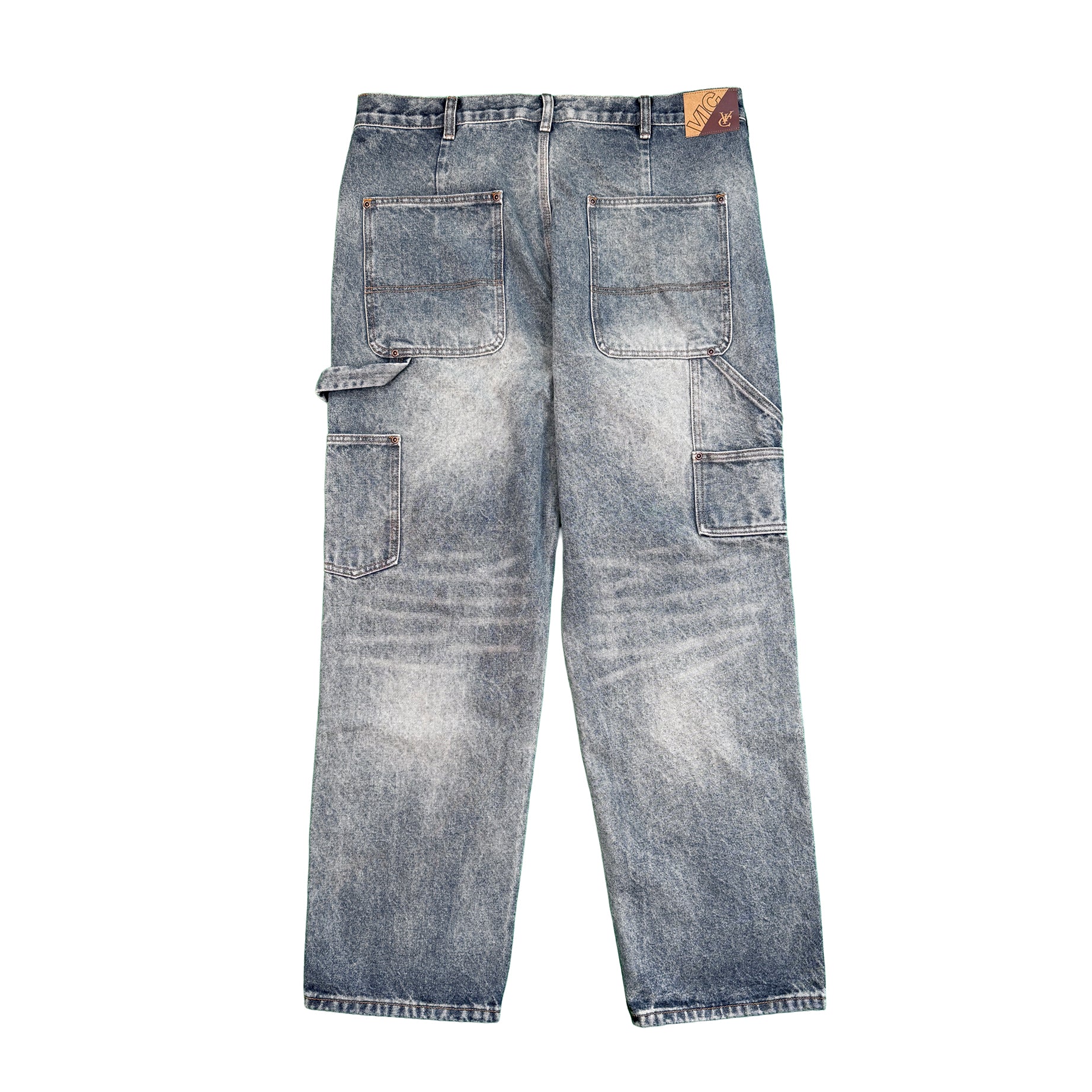 VIC Double Knee Jean in Washed Blue features a regular fit crafted from 100% cotton for durability and comfort. Designed with reinforced double-layer knees, vintage sandblasted finish, and functional tool pockets with a hammer loop. Includes belt loops with an internal drawstring waistband for adjustable fit, YKK zipper, and jacron paper label detail. Ideal for workwear-inspired everyday style with a classic worn-in look.