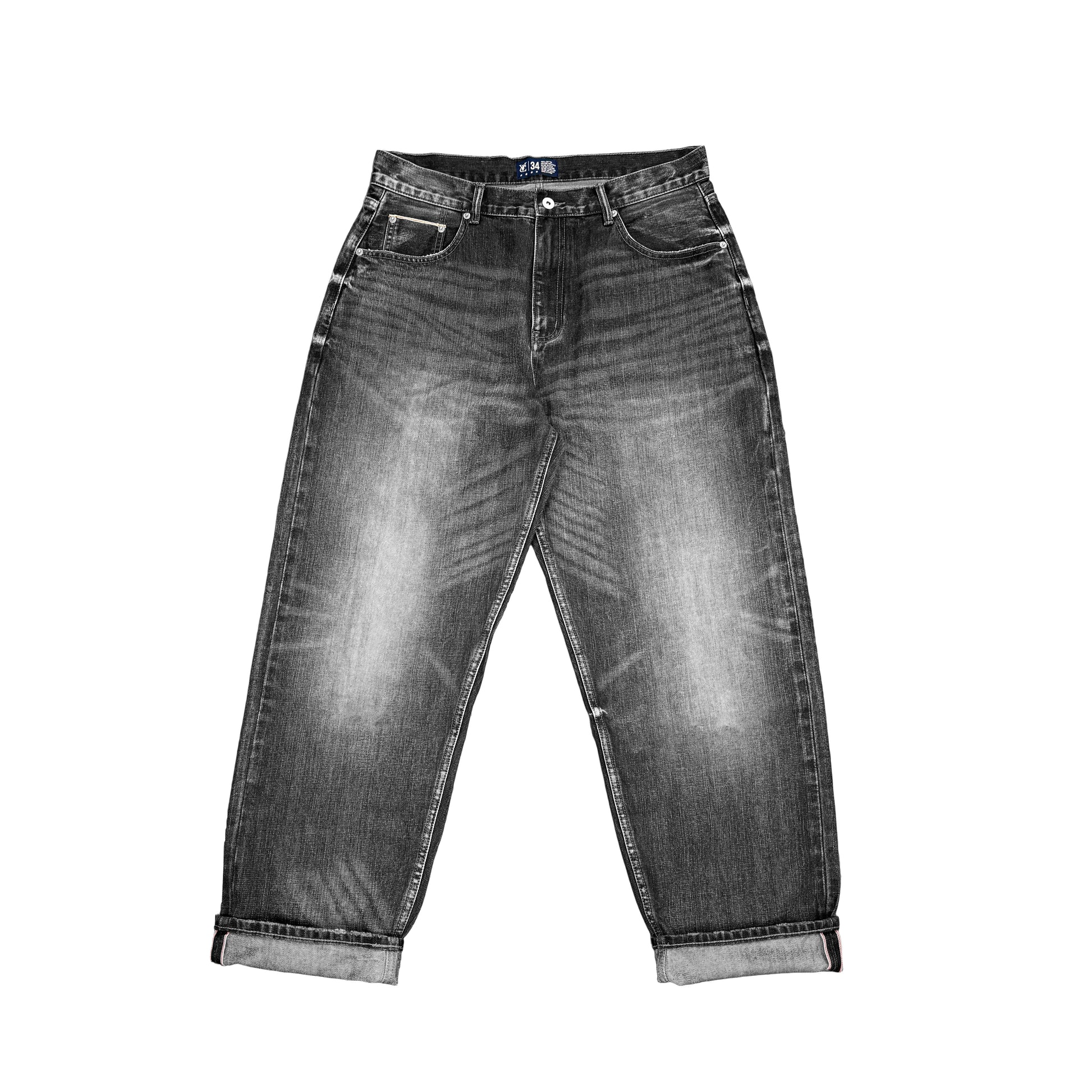 Baggy fit selvedge jean in 14.5oz denim with a vintage sandblasted treatment. Roomy thigh with tapered cuff. Detailed with selvedge accents on the coin pocket and a Jacron paper label patch on the waistband.