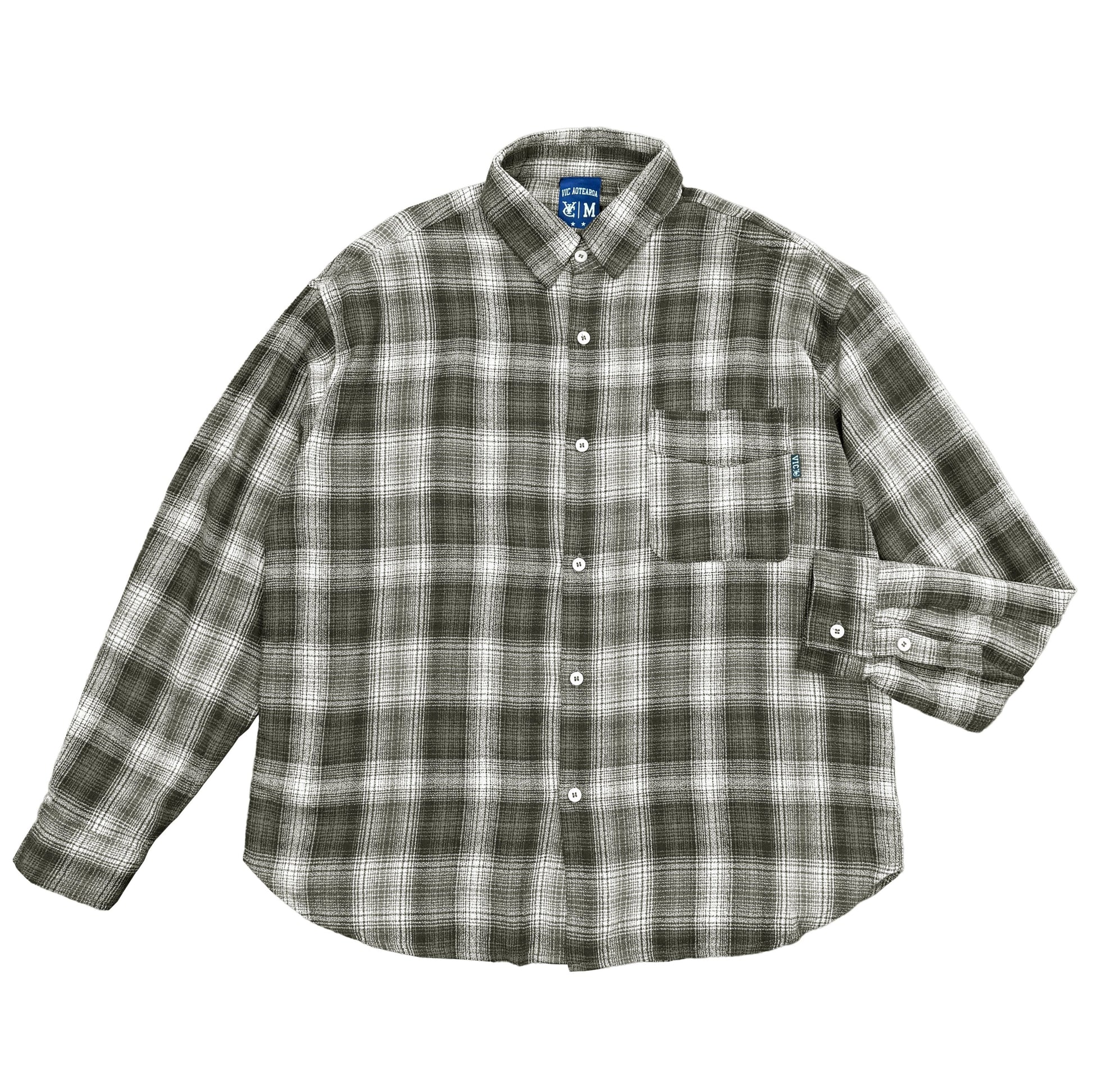 Elevate your casual wardrobe with the VIC Plaid Shirt. Made from 100% cotton, this shirt offers a relaxed box-fit and a soft-washed finish for ultimate comfort. The classic check pattern provides timeless style, while the distinctive VIC pip label detail on the chest pocket adds a unique touch. Whether you're dressing up for a weekend outing or down for a laid-back day, this plaid shirt is a versatile addition to your collection.