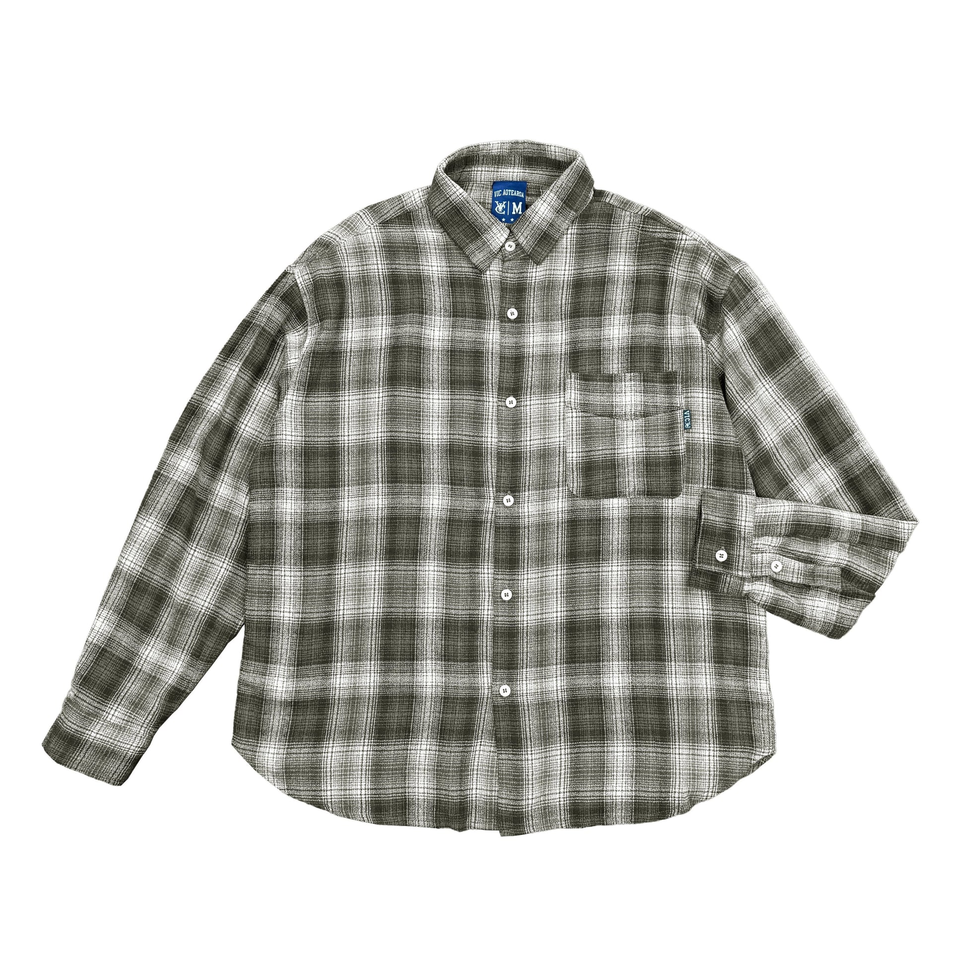 Elevate your casual wardrobe with the VIC Plaid Shirt. Made from 100% cotton, this shirt offers a relaxed box-fit and a soft-washed finish for ultimate comfort. The classic check pattern provides timeless style, while the distinctive VIC pip label detail on the chest pocket adds a unique touch. Whether you're dressing up for a weekend outing or down for a laid-back day, this plaid shirt is a versatile addition to your collection.