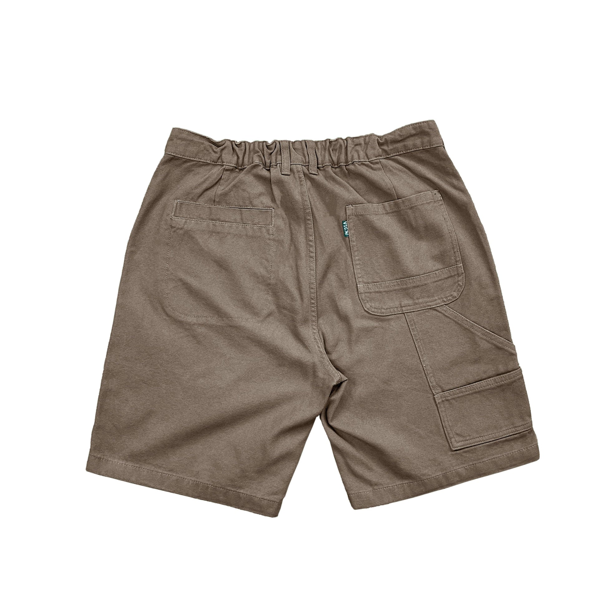Discover our Canvas Work Shorts: vintage-inspired yet modern. Crafted from heavyweight 365 gsm cotton duck canvas, they offer a 90s retro style in a regular fit. Featuring a YKK zip fly, elastic back waistband, and VIC label flag, they're durable and comfortable. With 2 side pockets, 2 back pockets, and dual back pockets with a coin pocket, they're practical for work or leisure. Order up for a generous fit. Elevate your style with our Canvas Work Shorts!