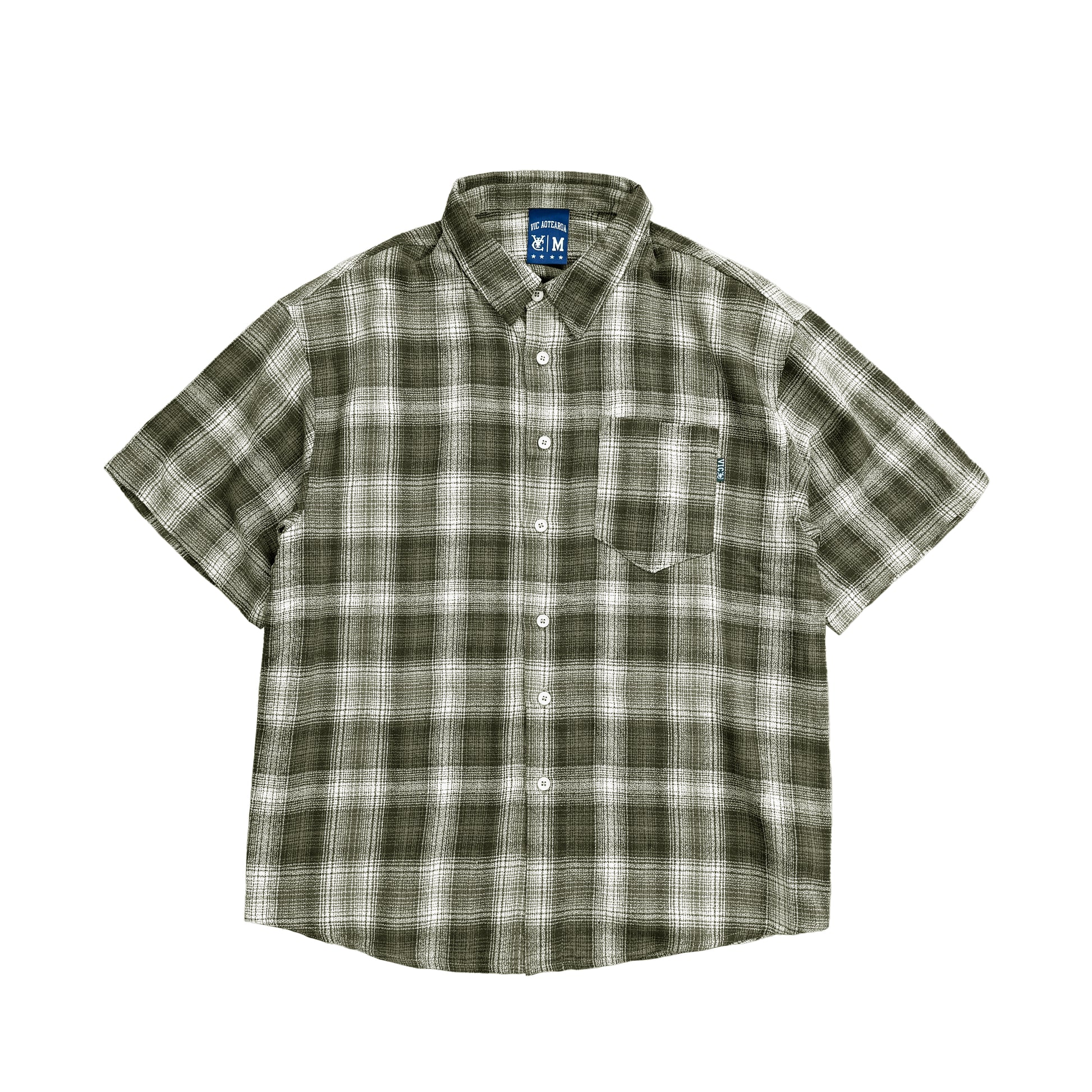 Embrace vintage 90s surf vibes with the VIC Check Short Sleeve Shirt. Crafted from lightweight cotton with a yarn-dyed check pattern, it features a relaxed boxy fit, soft-washed finish, curved hem, and a chest pocket with a subtle VIC label. Perfect for casual beach days, summer barbecues, or everyday wear.