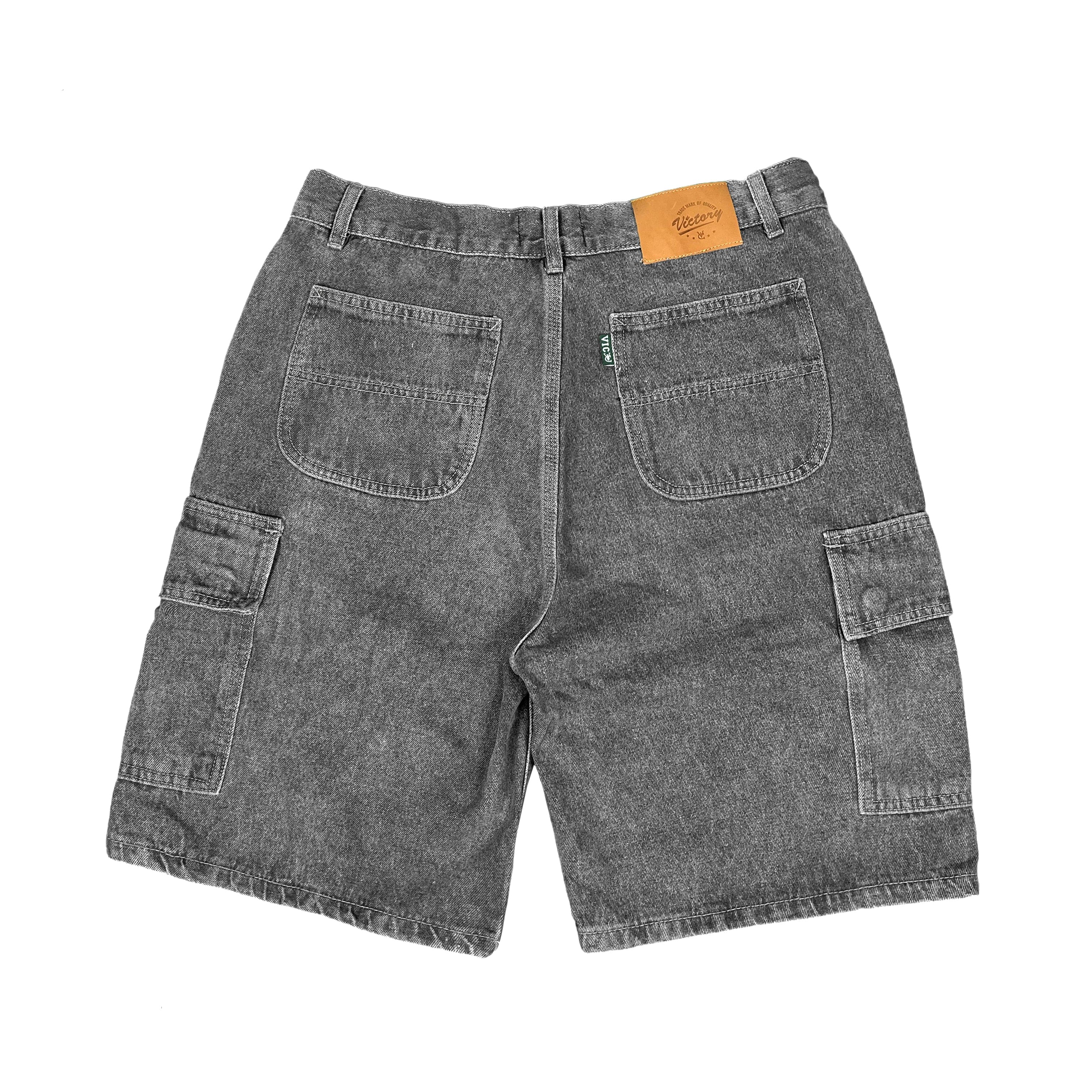 Premium quality cargo denim jean shorts by New Zealand skate and streetwear clothing label VIC Apparel. Loose fit. Featuring utility pockets and triple needle contrast stitching with VIC label flag at the back right pocket. Classic vintage workwear style. 90s baggy jorts style