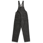 The denim Bib Overall by streetwear and skate brand VIC. It takes inspiration from classic workwear, but has been tailored to give a contemporary silhouette. Constructed from our heavyweight denim with contrast stitching, it features multiple utility pockets and hammer loop on the left thigh.
