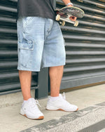 Premium quality cargo denim jean shorts by New Zealand skate and streetwear clothing label VIC Apparel. Loose fit. Featuring utility pockets and triple needle contrast stitching with VIC label flag at the back right pocket. Classic vintage workwear style.