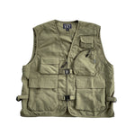 VIC Utility Vest / Inspired by vintage workwear silhouettes : Boxy fit / 100% Polyester, durable water resistant coating / Two way zip closure at front / 5 front pockets / 2 quick release buckles & side closures for layering / Hidden pocket at centre back / VIC woven flag label at front left chest pocket 